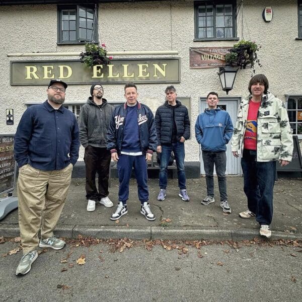Northern Soul band Smoove & Turrell posed for a photo infront of a pub